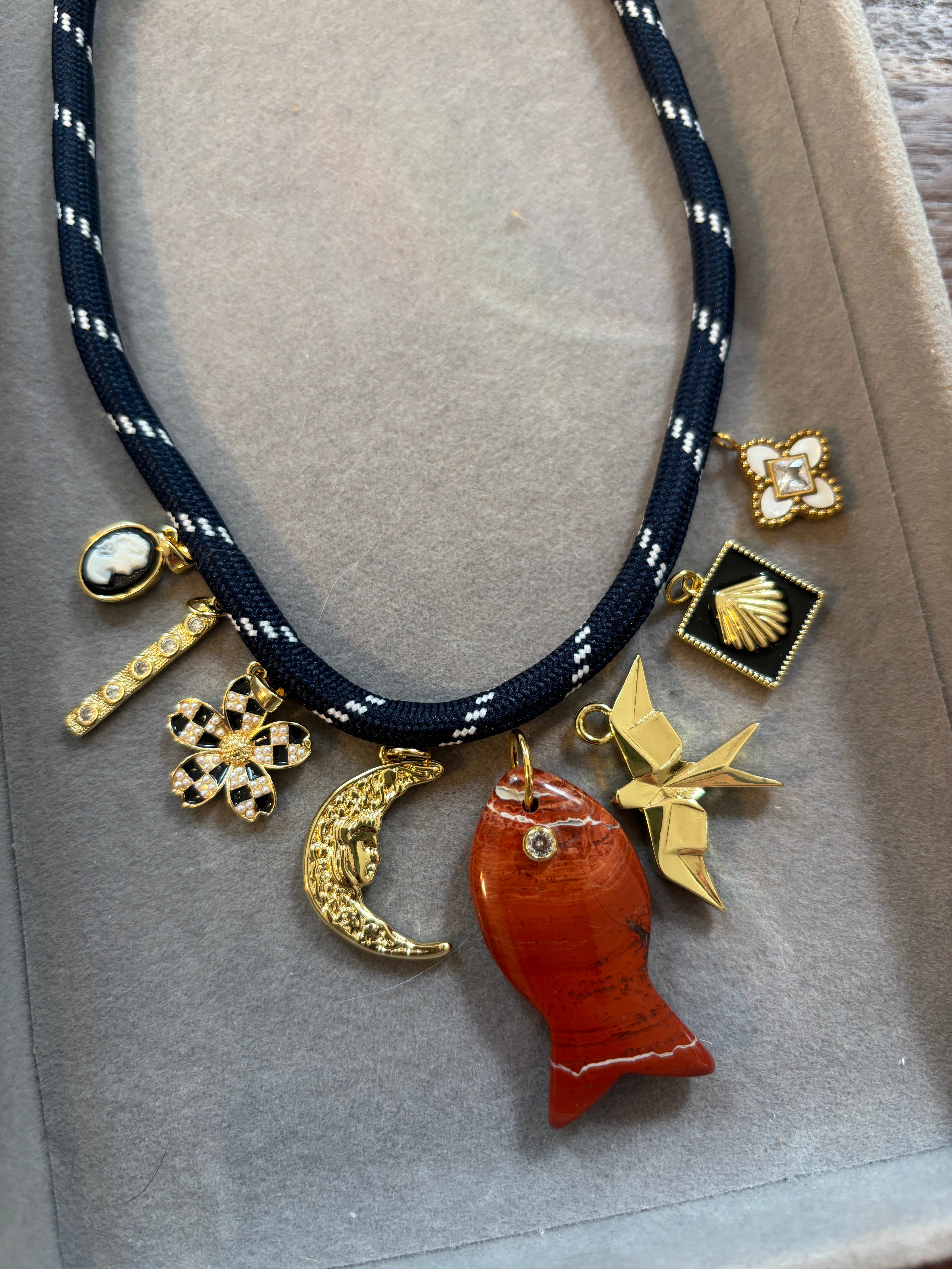RED FISH ON NAVY CORD NECKLACE