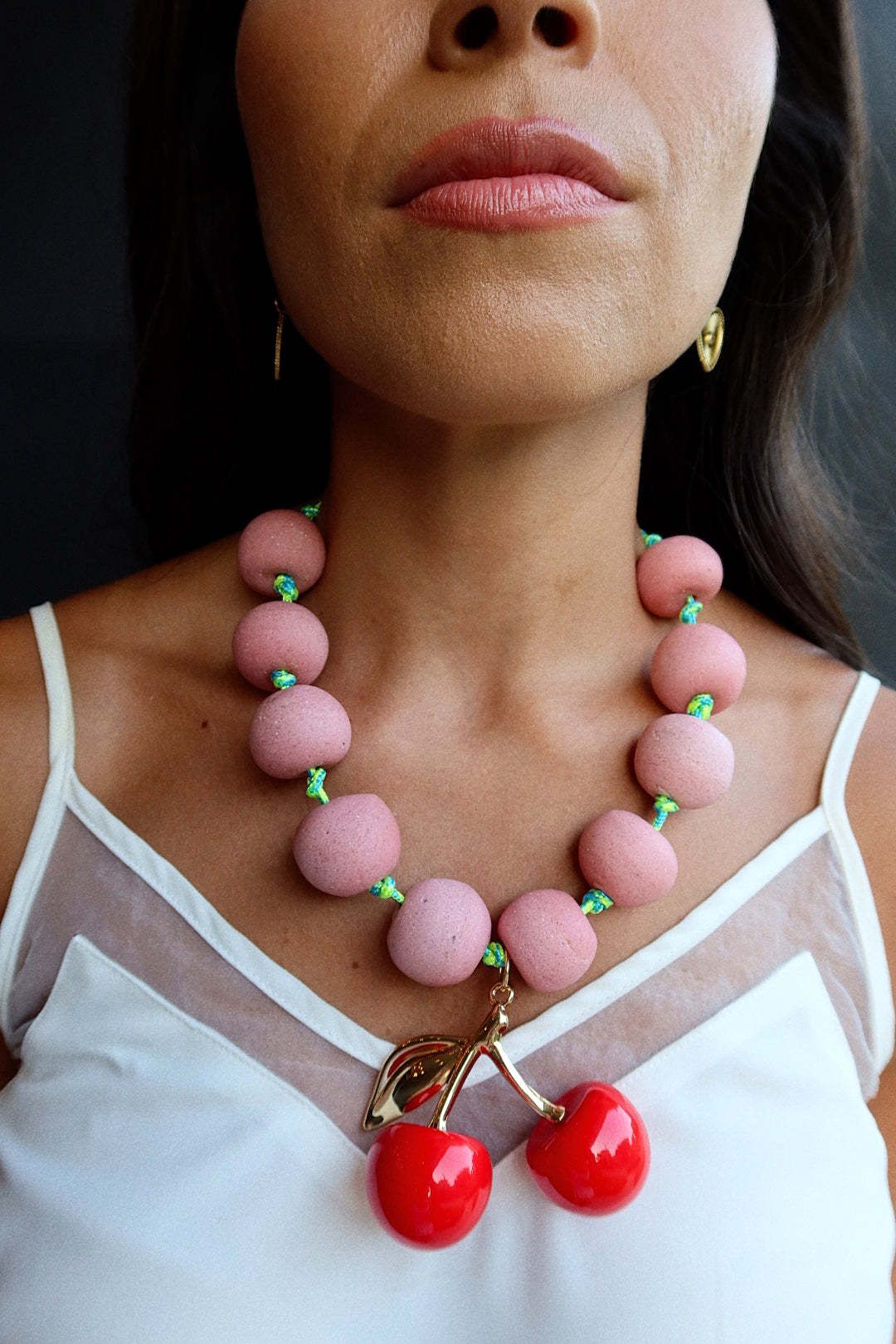 CHERRY BOMB (PINK BEADS ON CORD)